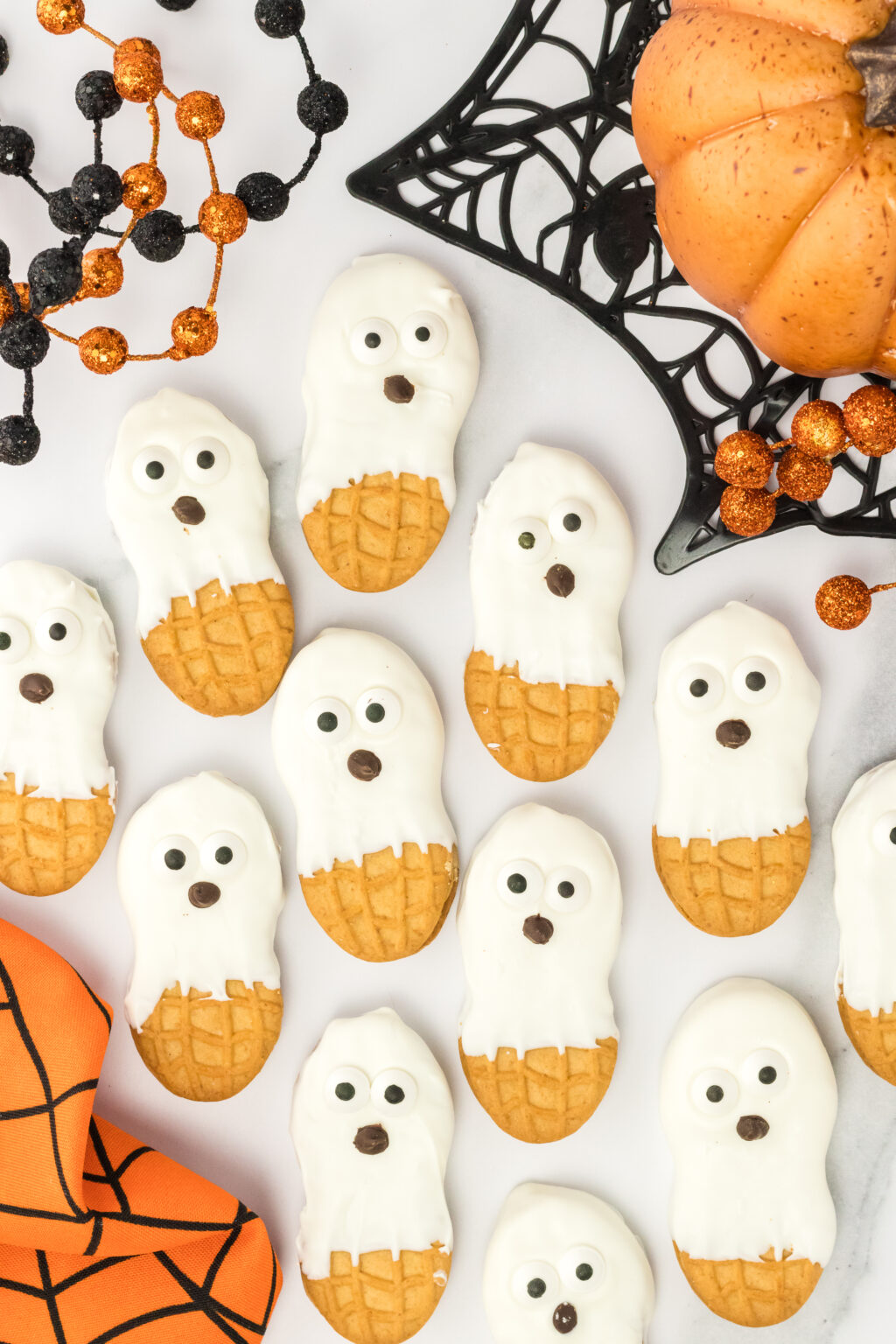 nutter butter ghost cookies laid out on a white background