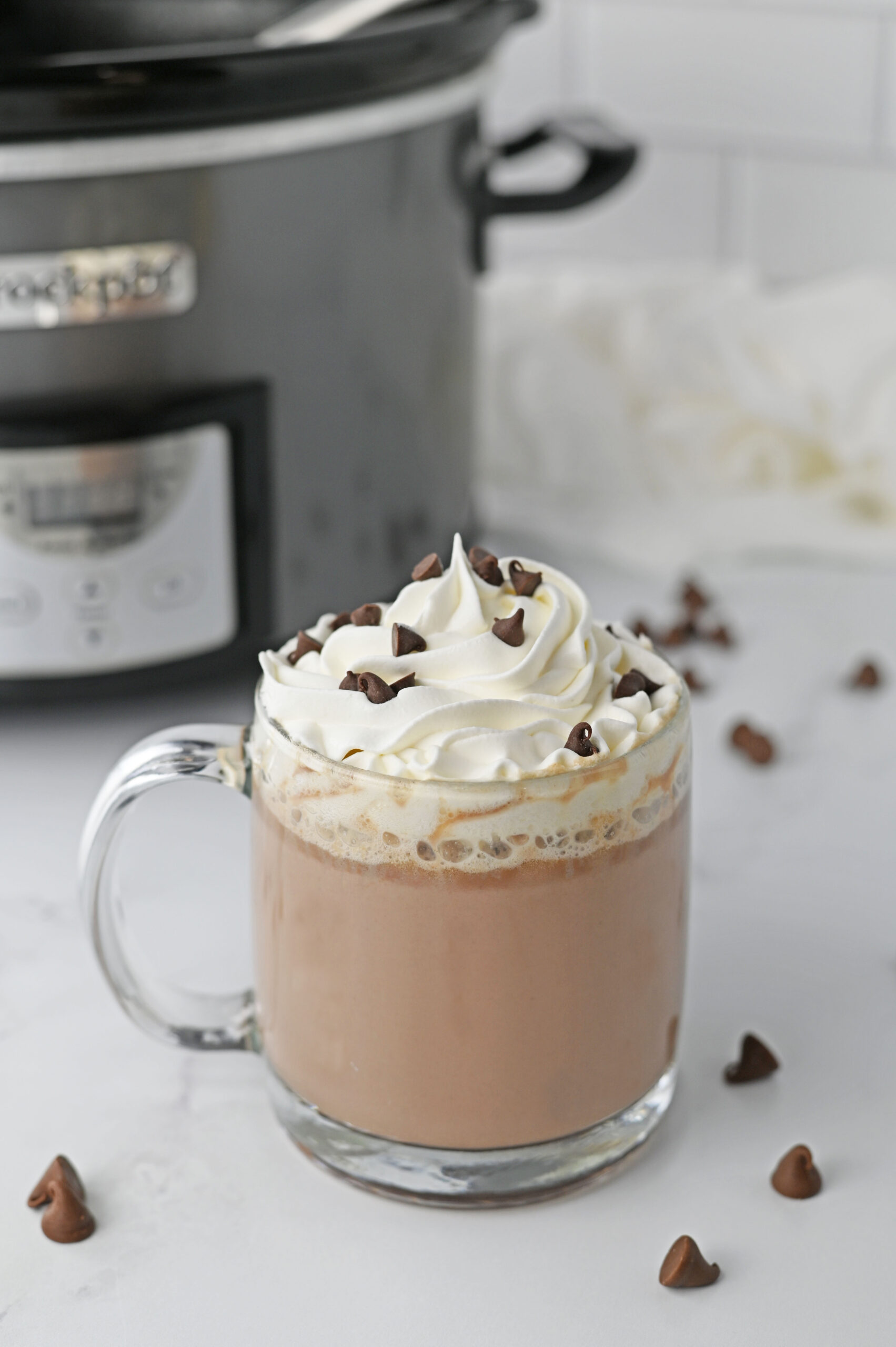 clear glass mug of slow cooker hot chocolate