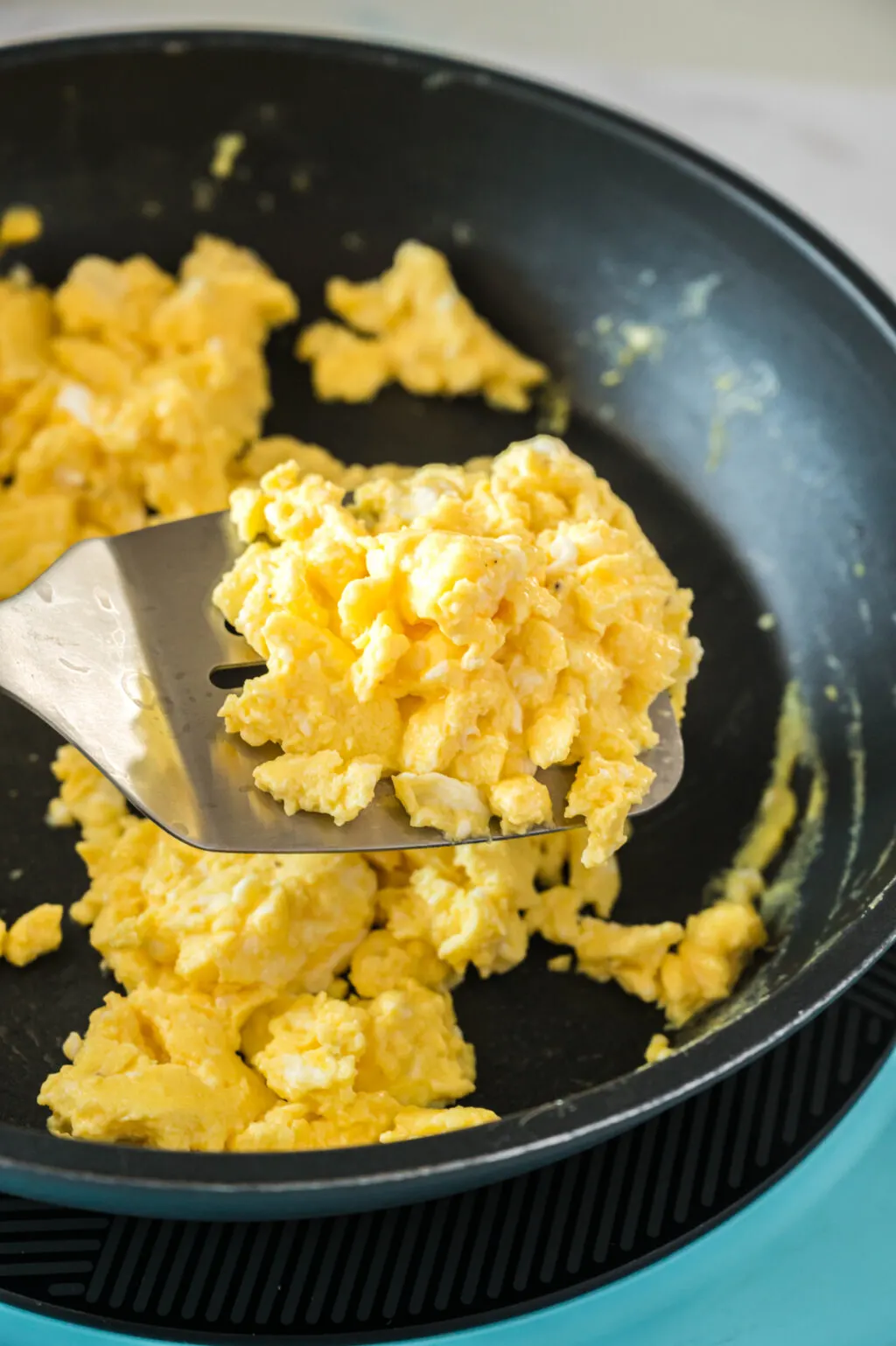 scrambled eggs on a spatula