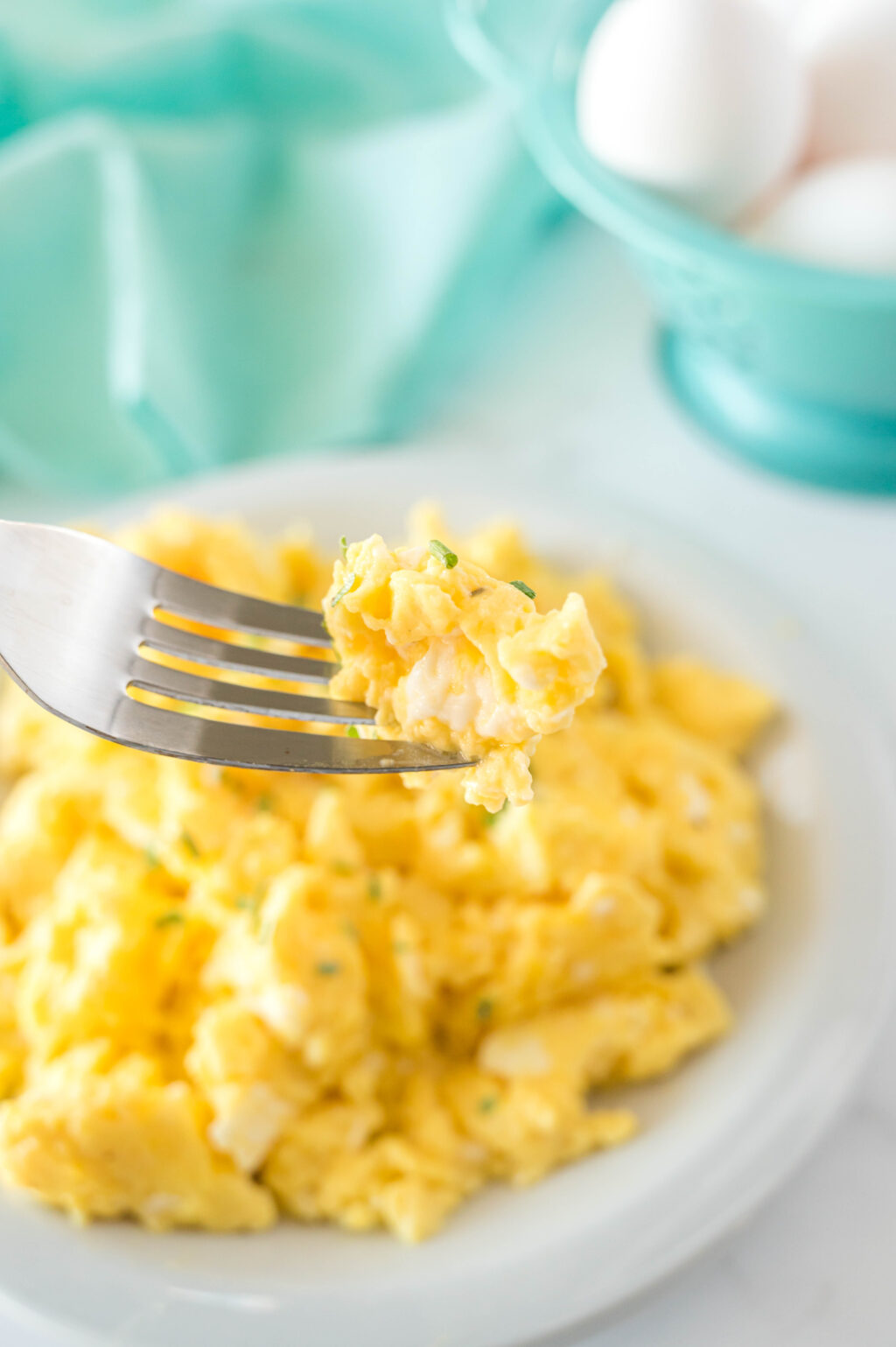 fluffy scrambled eggs on a fork