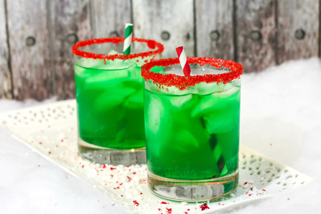 two glasses filled with green grinch punch