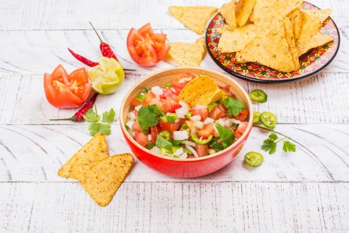 Easy Pico de Gallo Recipe - This Easy Pico de Gallo Recipe can be made in just a few minutes using fresh tomatoes, onion, peppers, garlic, cilantro, lime and lemon. It adds the perfect amount of flavor and kick to any dish!