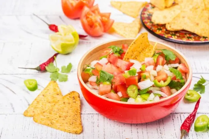 Easy Pico de Gallo Recipe - This Easy Pico de Gallo Recipe can be made in just a few minutes using fresh tomatoes, onion, peppers, garlic, cilantro, lime and lemon. It adds the perfect amount of flavor and kick to any dish!