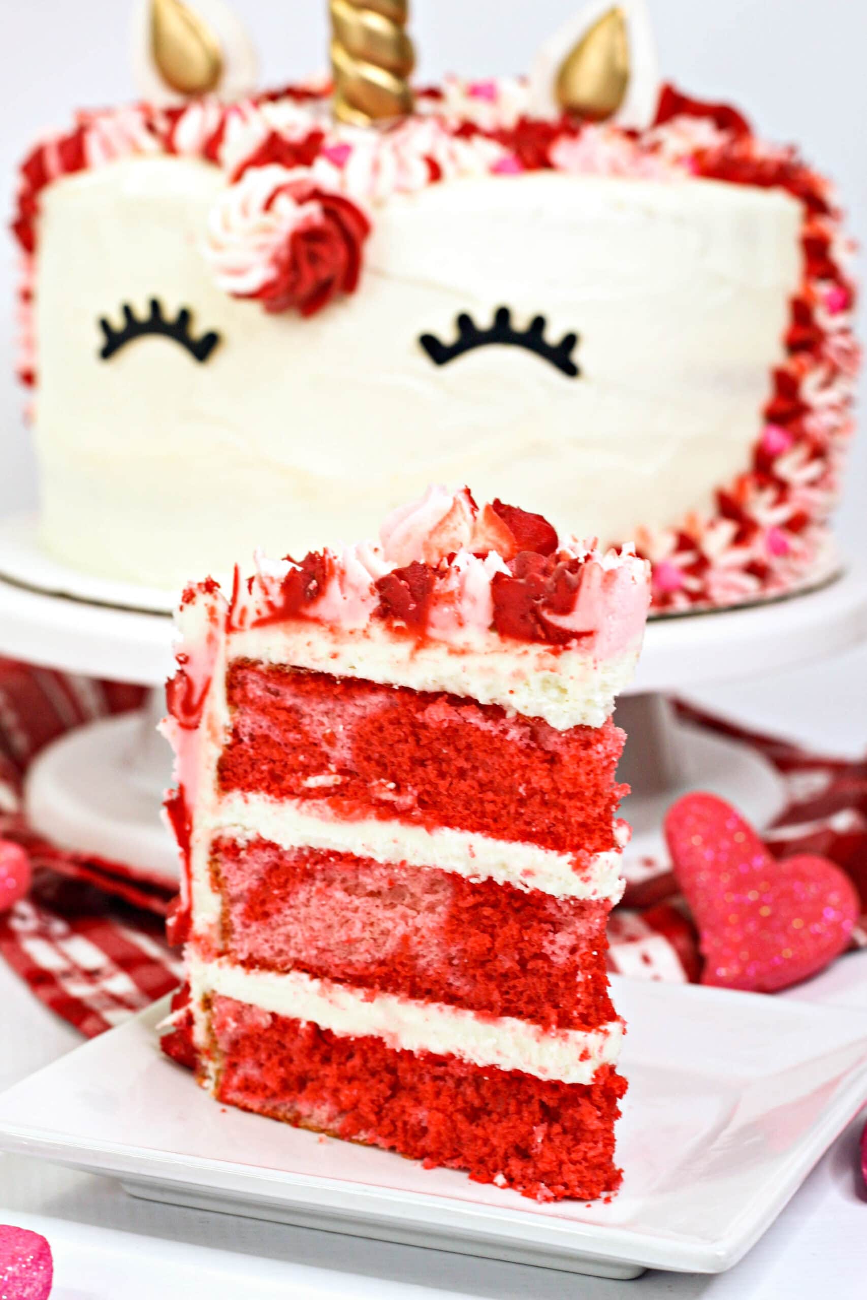 Valentine Unicorn Cake is the perfect homemade Valentine's Day treat. It is layered with pink and red vanilla cake and topped with homemade vanilla frosting.