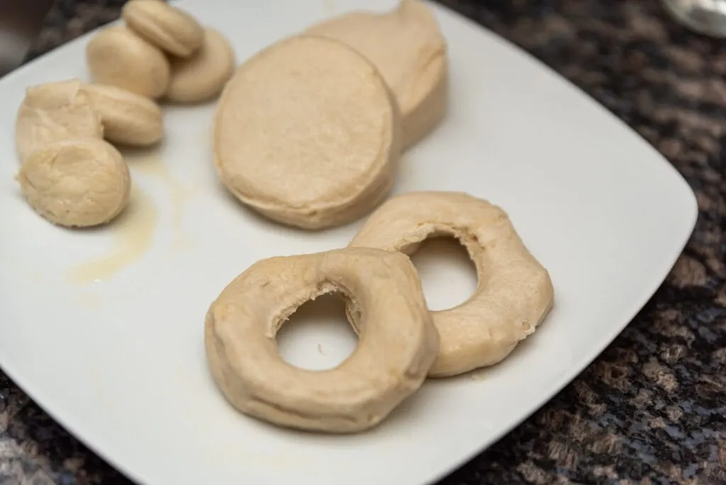 biscuits cut to look like donuts on a plate