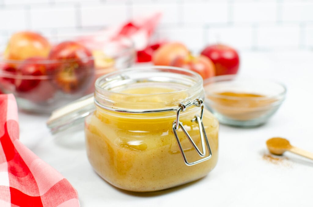 homemade applesauce in a glass jar with lid