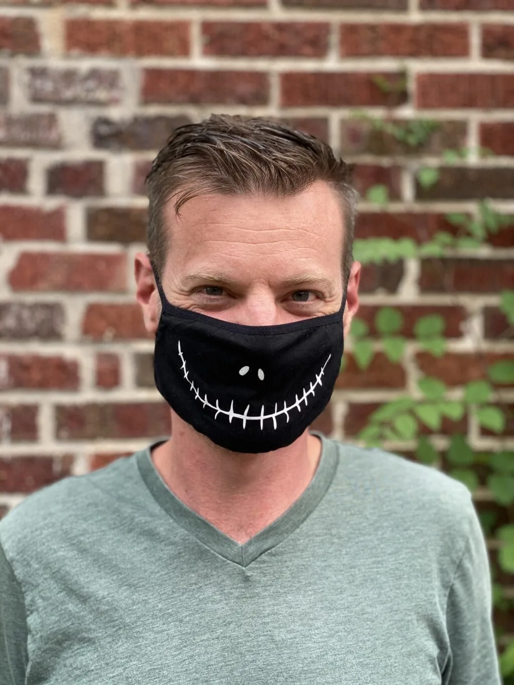 man wearing a jack skellington face mask