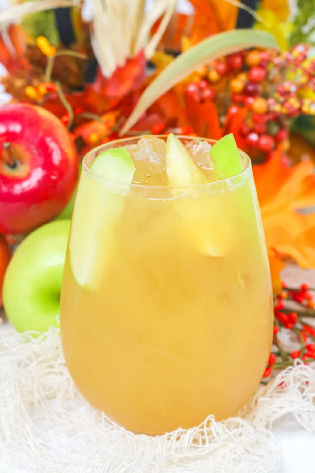 caramel apple cider cocktail in a cup