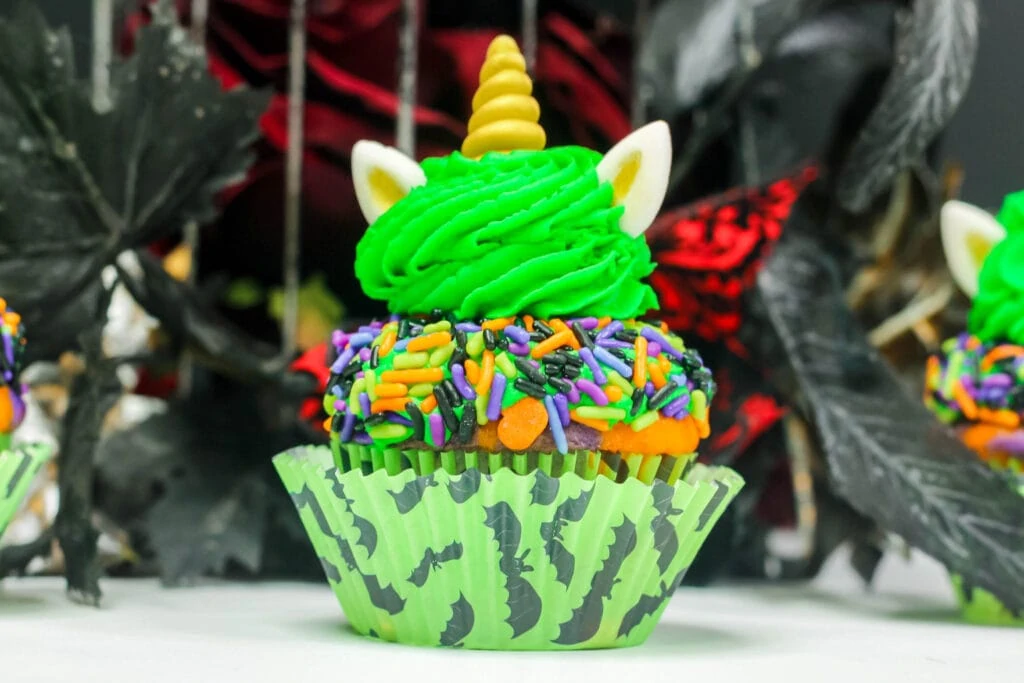unicorn Halloween cupcake covered in sprinkles