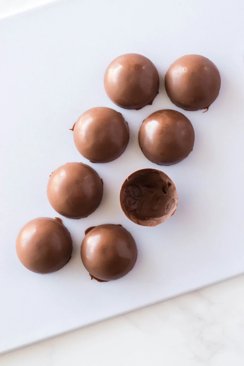chocolate spheres on a cutting board