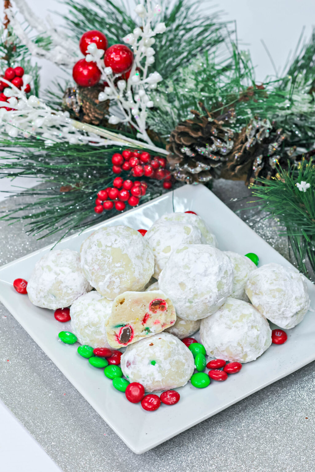christmas snowball cookies with christmas M&M's inside