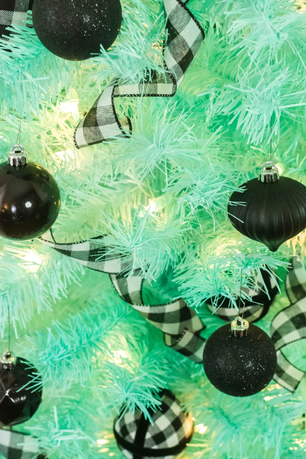 mint christmas tree with black christmas tree decorations