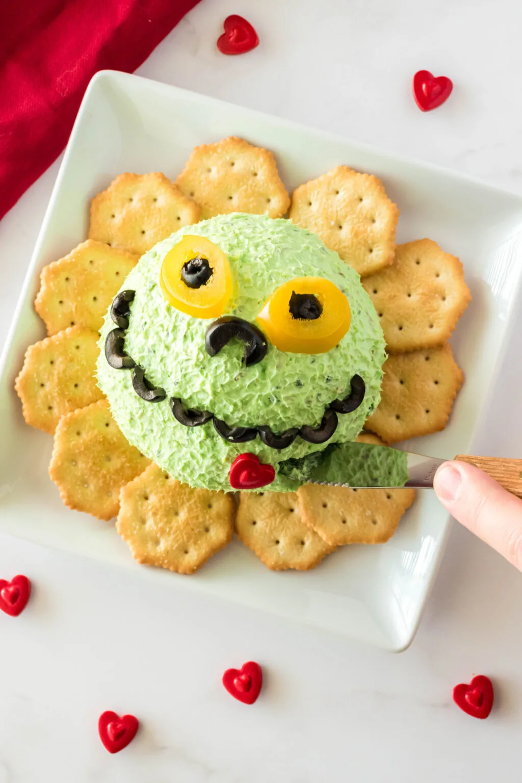 grinch cheese ball on serving plate
