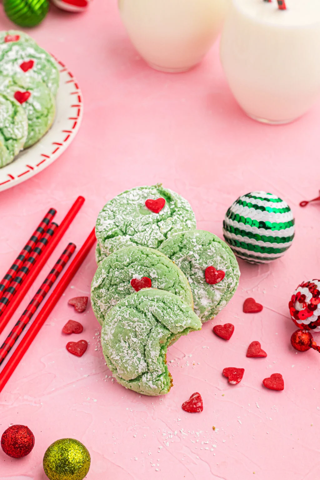 grinch cookies on pink table