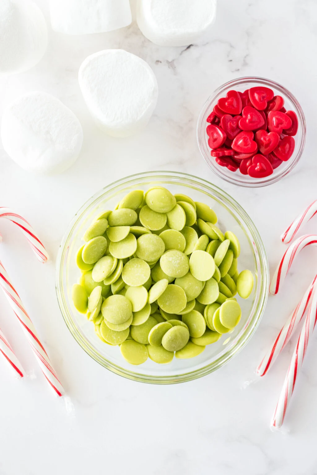 grinch marshmallow stirrers ingredients on table