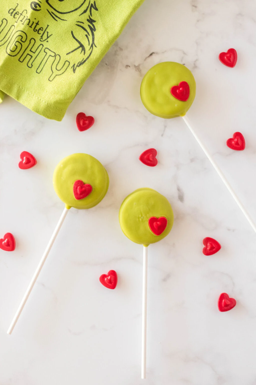 grinch oreo pops on table