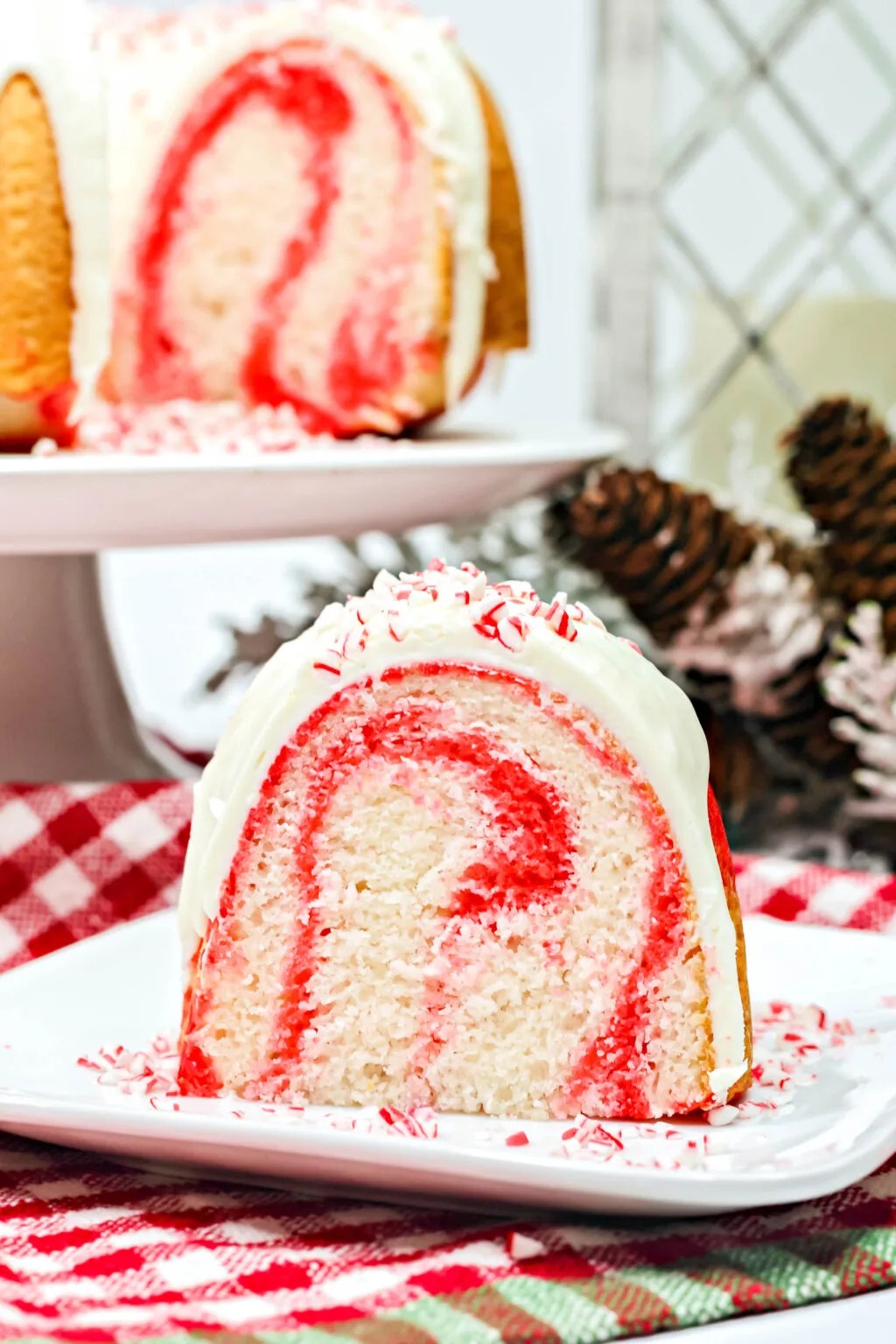 side view of a slice of peppermint candy cane cake