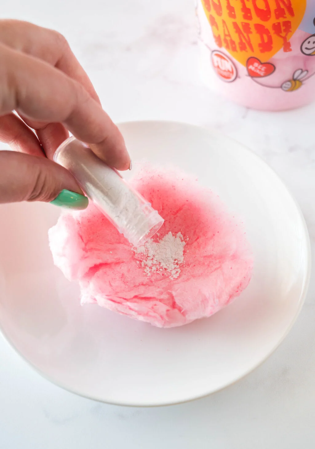 edible glitter being poured into cotton candy
