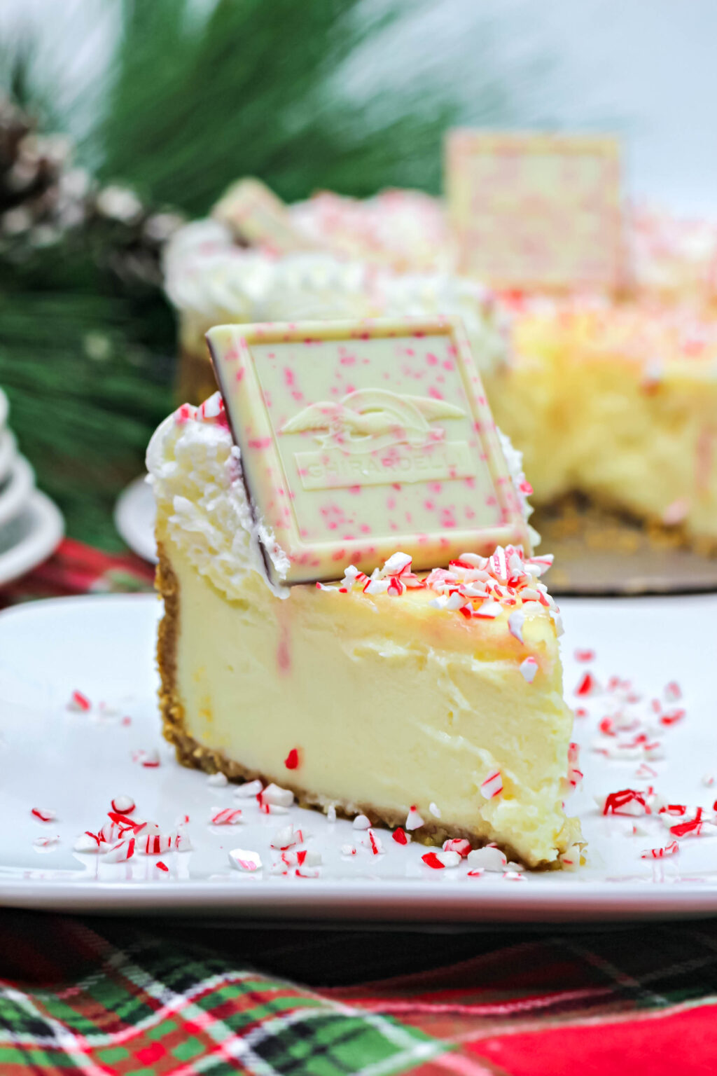 slice of white chocolate peppermint cheesecake on a plate