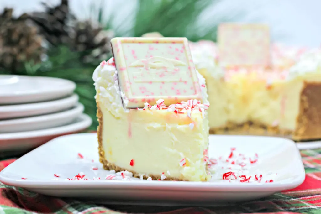front view of a slice of peppermint cheesecake on a plate