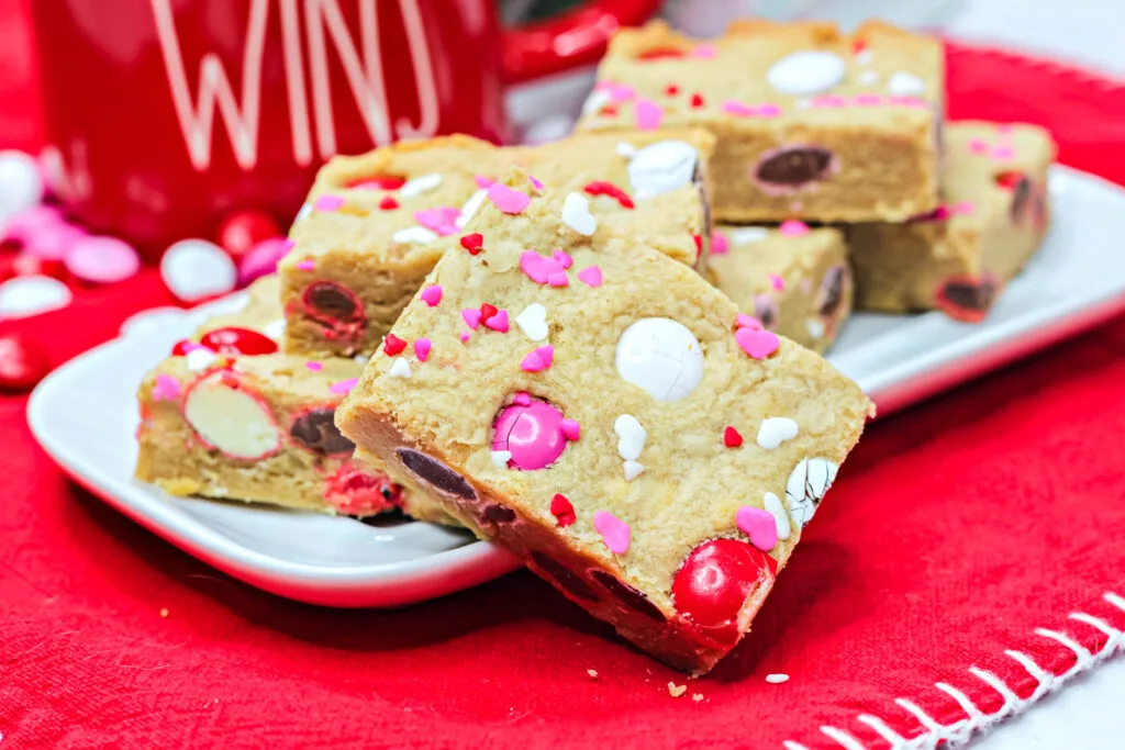 valentine cookie bars stacked on a plate