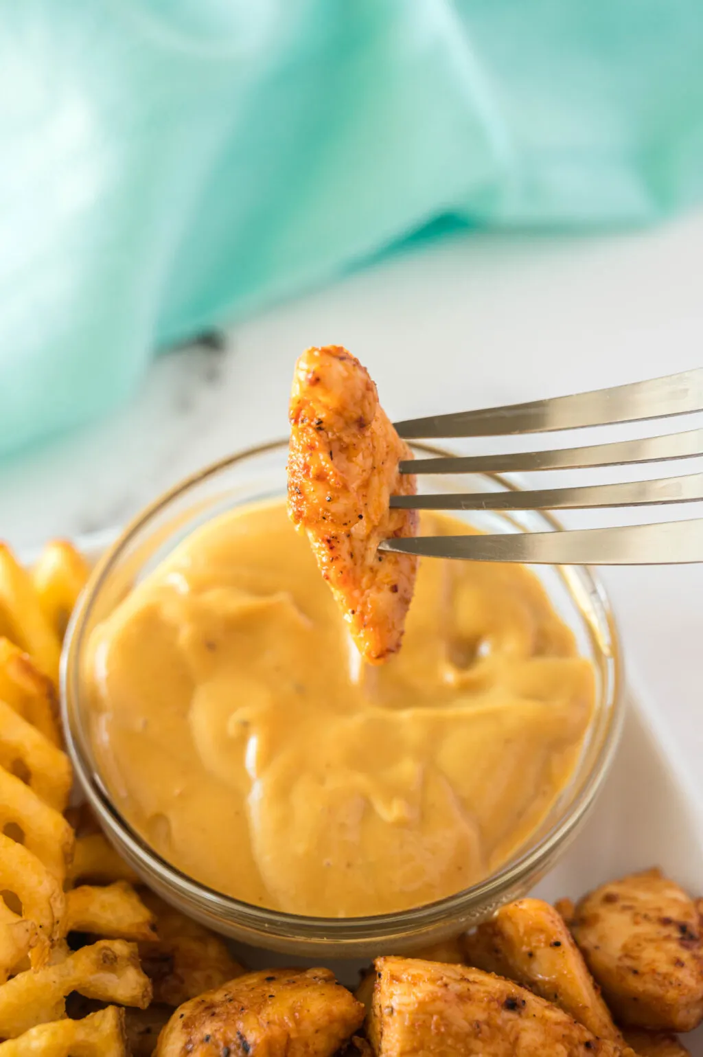 copycat chick-fil-a grilled nuggets dipped in chick-fil-a sauce