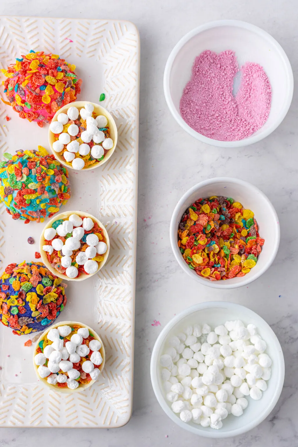 filling the fruity pebbles hot cocoa bombs