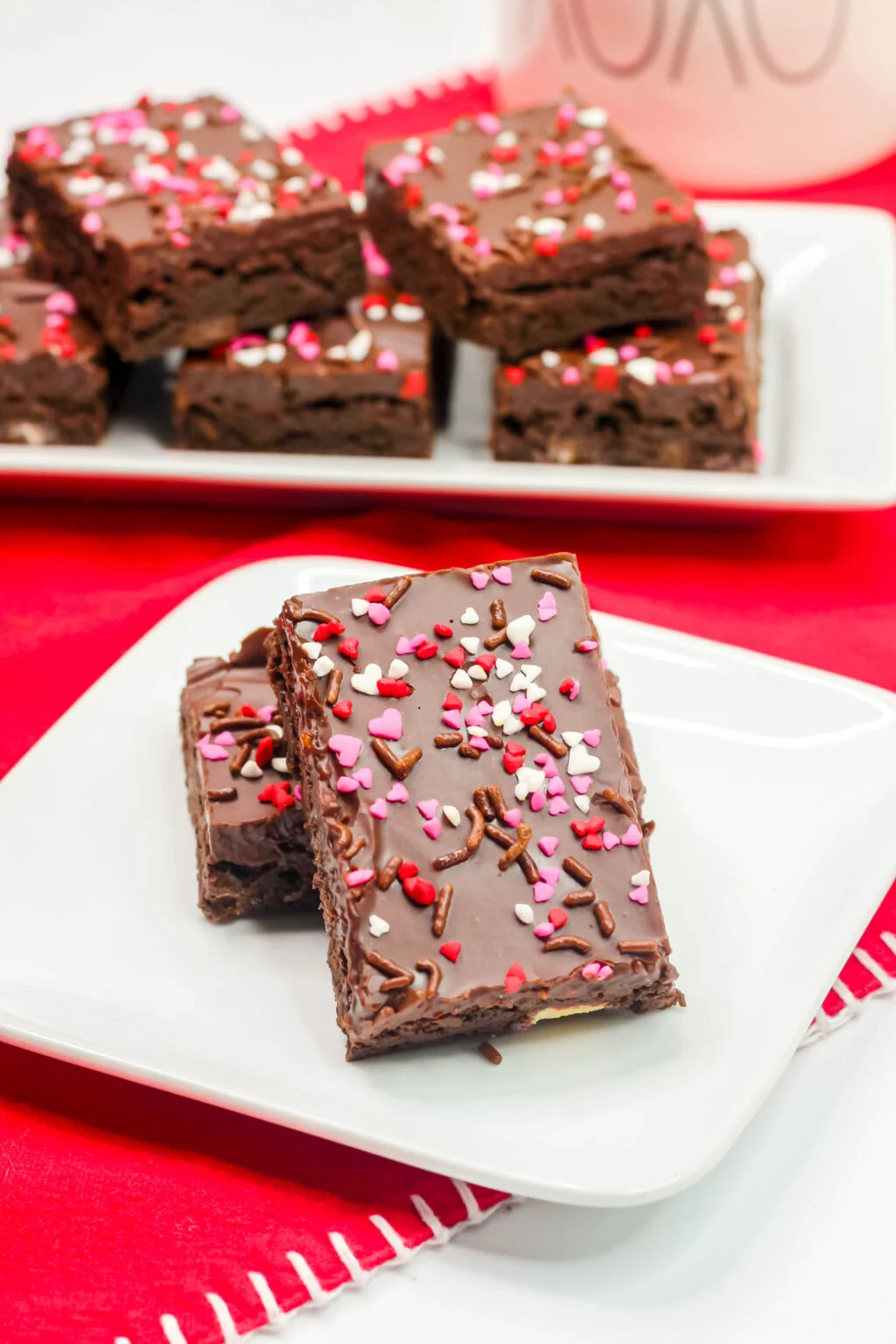 stacked Valentine's Day Brownies on a white plate