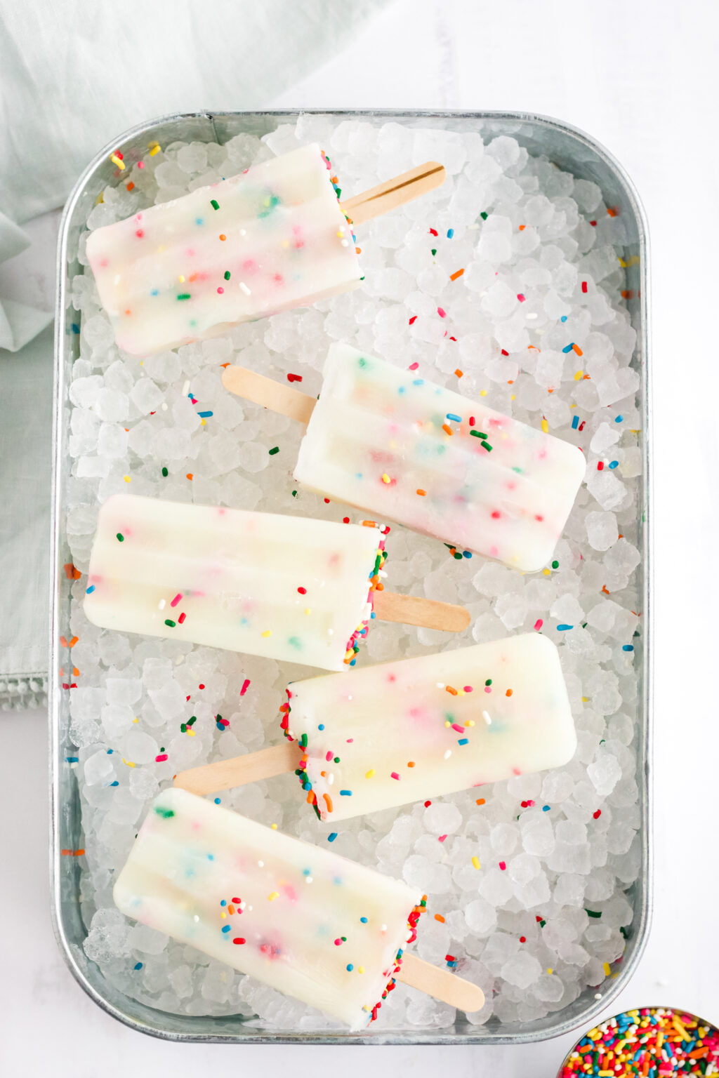 funfetti cake mix popsicles on tray of ice