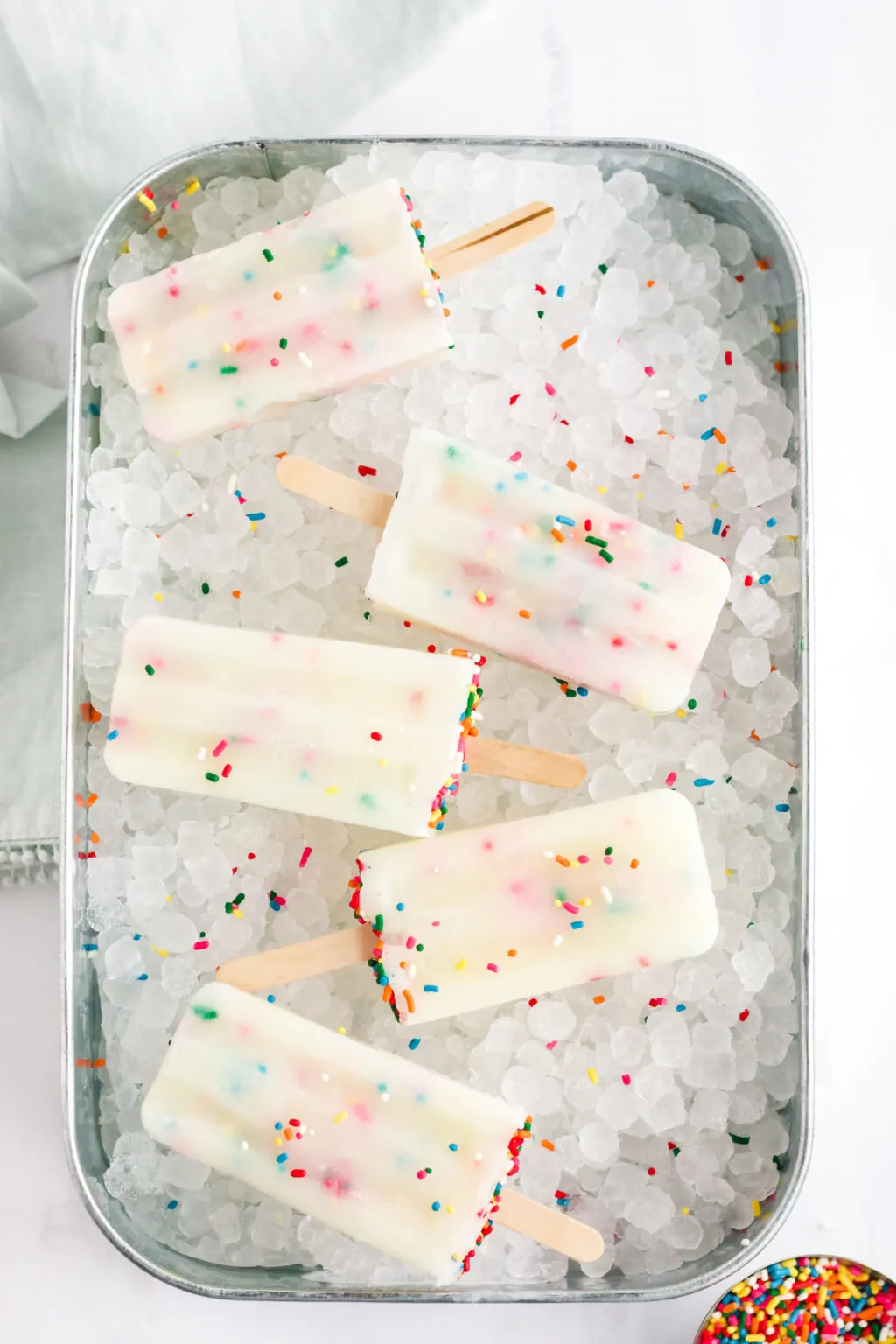 funfetti cake mix popsicles on tray of ice