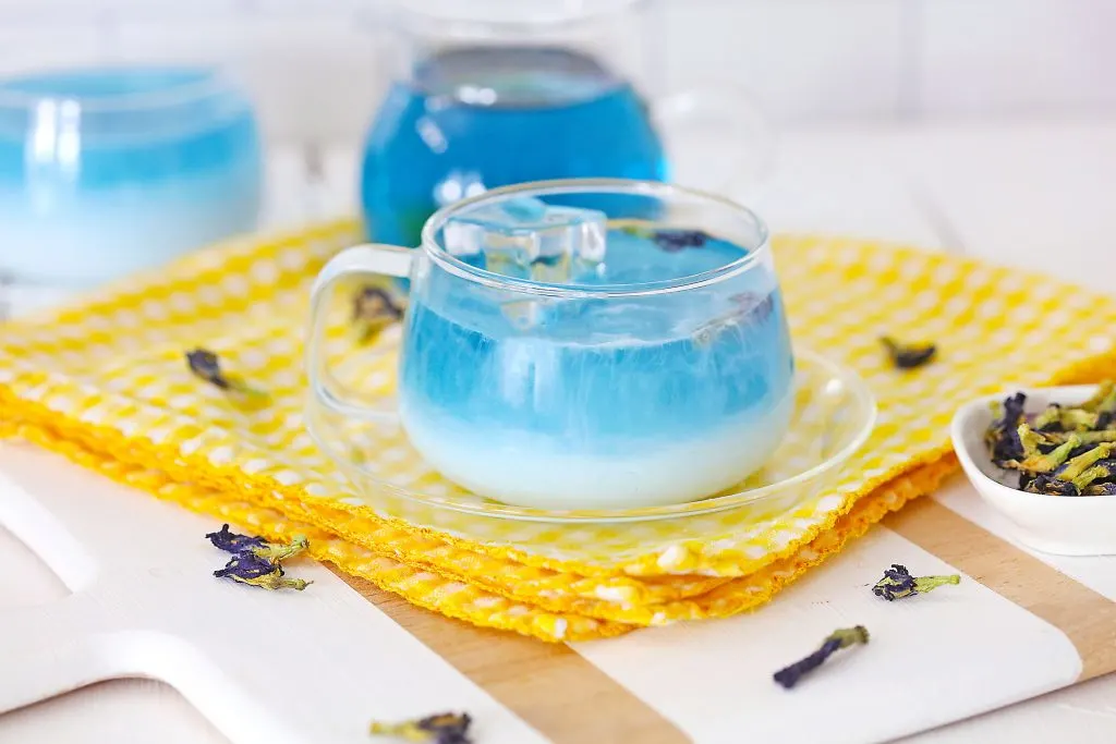 Butterfly Pea Tea Latte in a clear cup