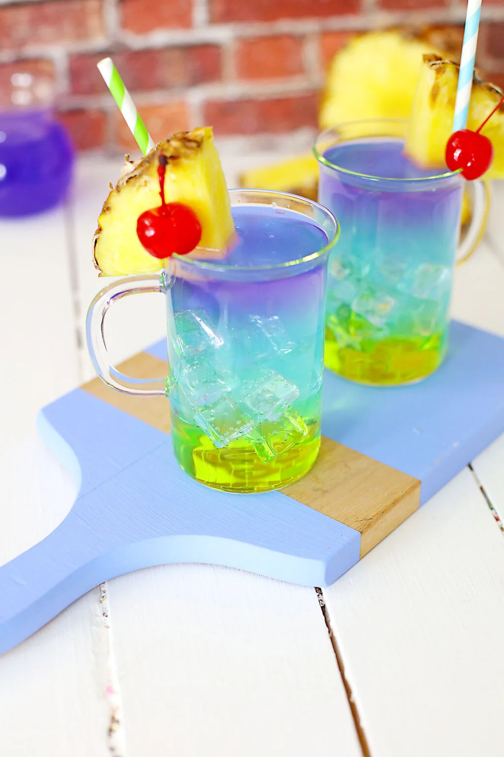 colorful layered mermaid cocktails on a table