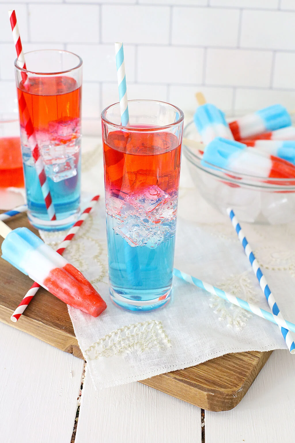 layered bomb pop cocktail in clear glass