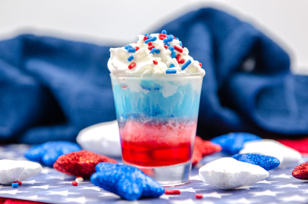 red, white and blue shot on table