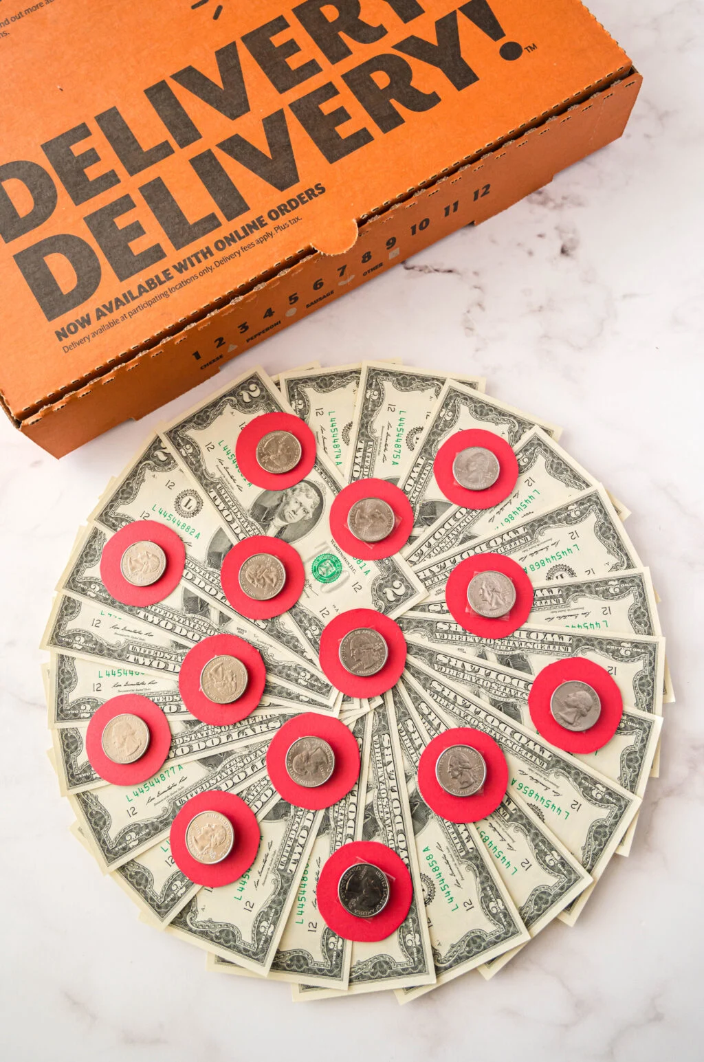 money pizza in pizza box