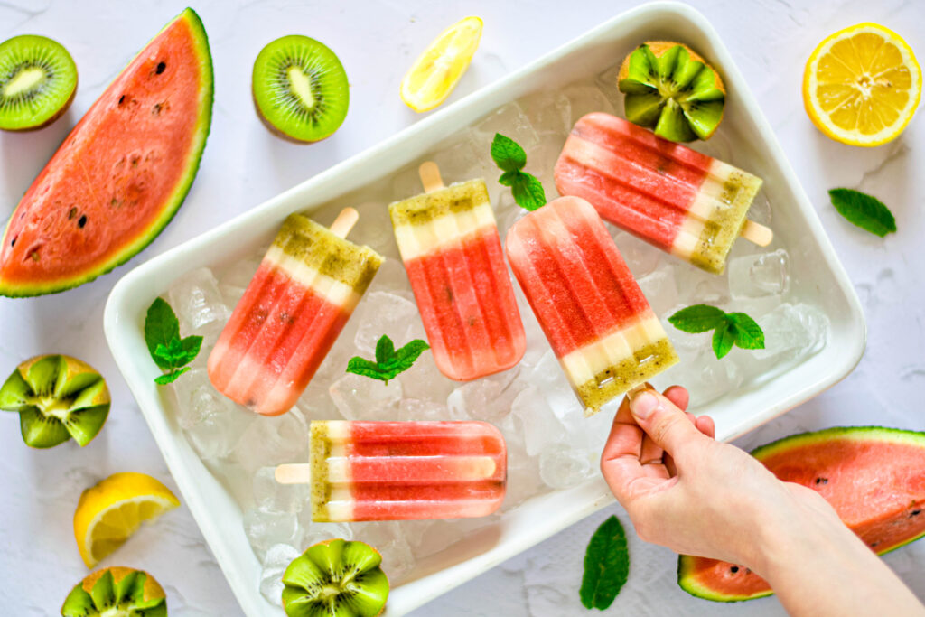 homemade watermelon popsicles on tray of ice