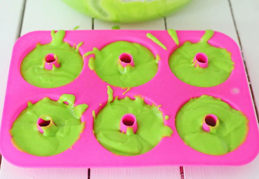 grinch donuts batter in donut pan