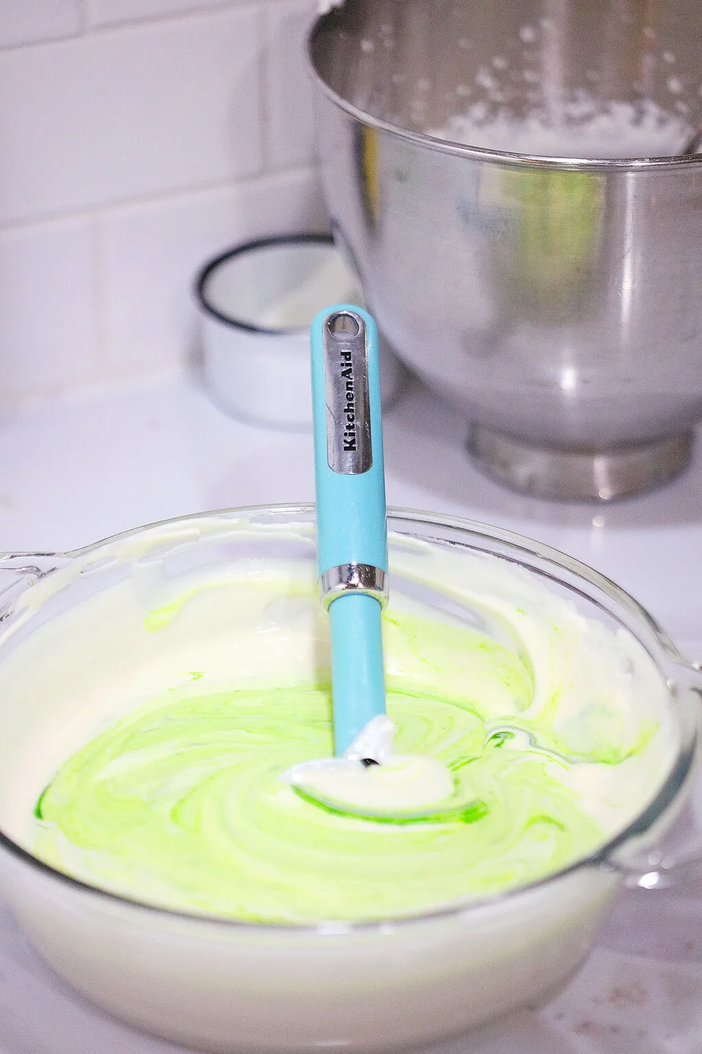green whipped cream in a glass bowl
