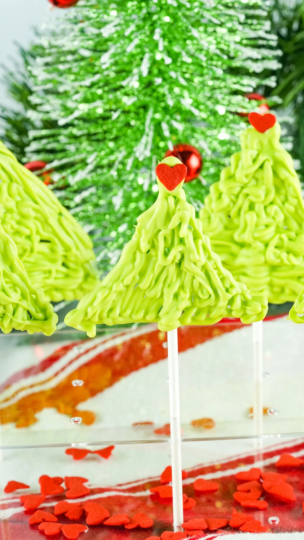 chocolate grinch suckers in a stand