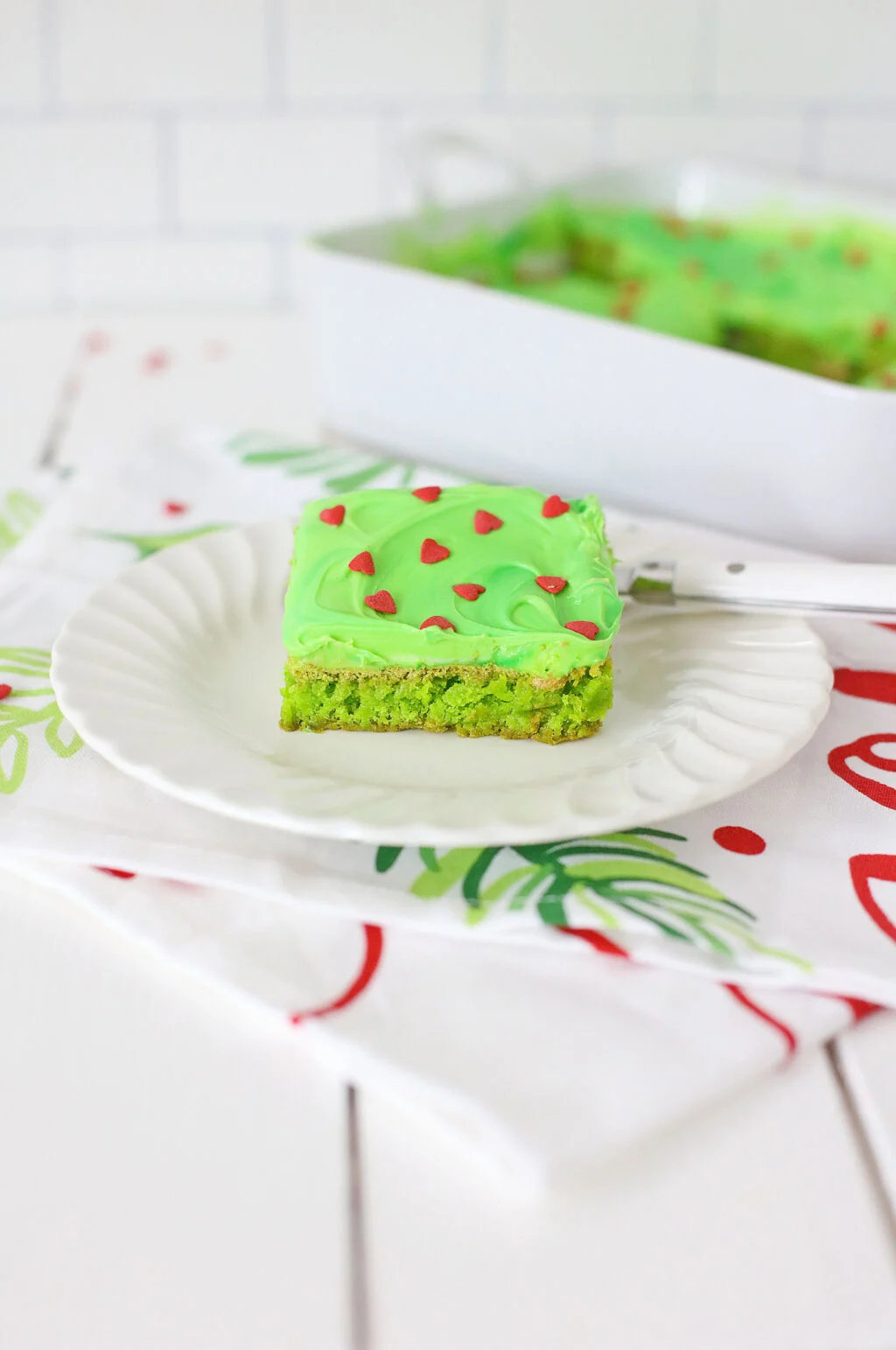 slice of grinch brownie on a white plate