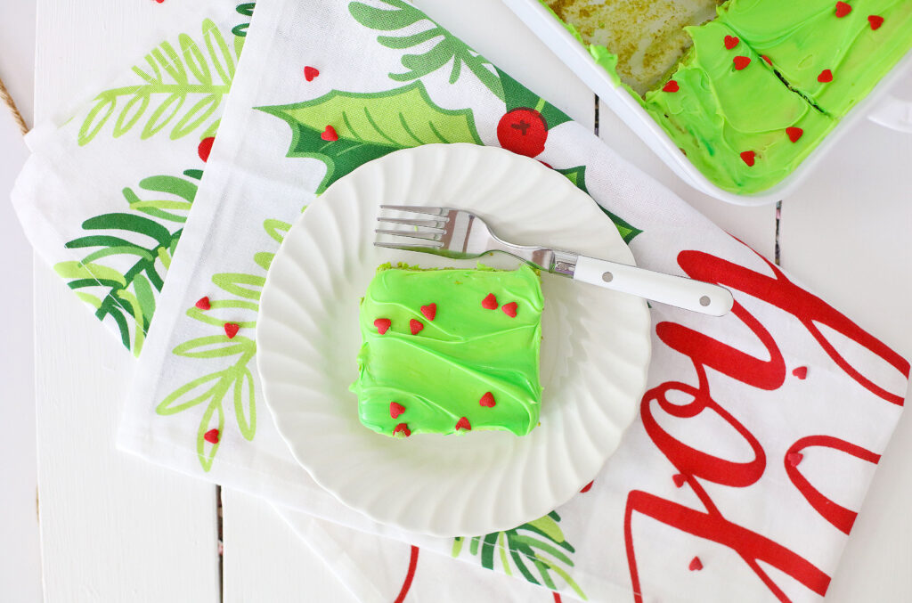 top view of grinch brownie on a white plate with a fork