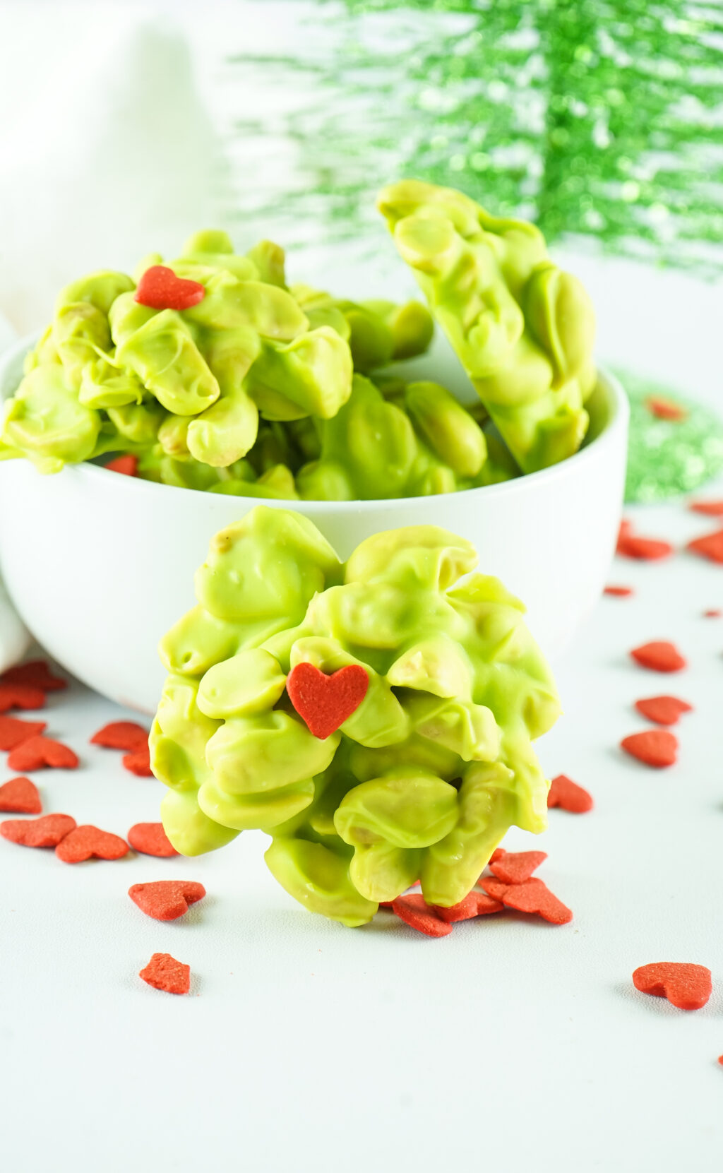 grinch peanut clusters in a white bowl