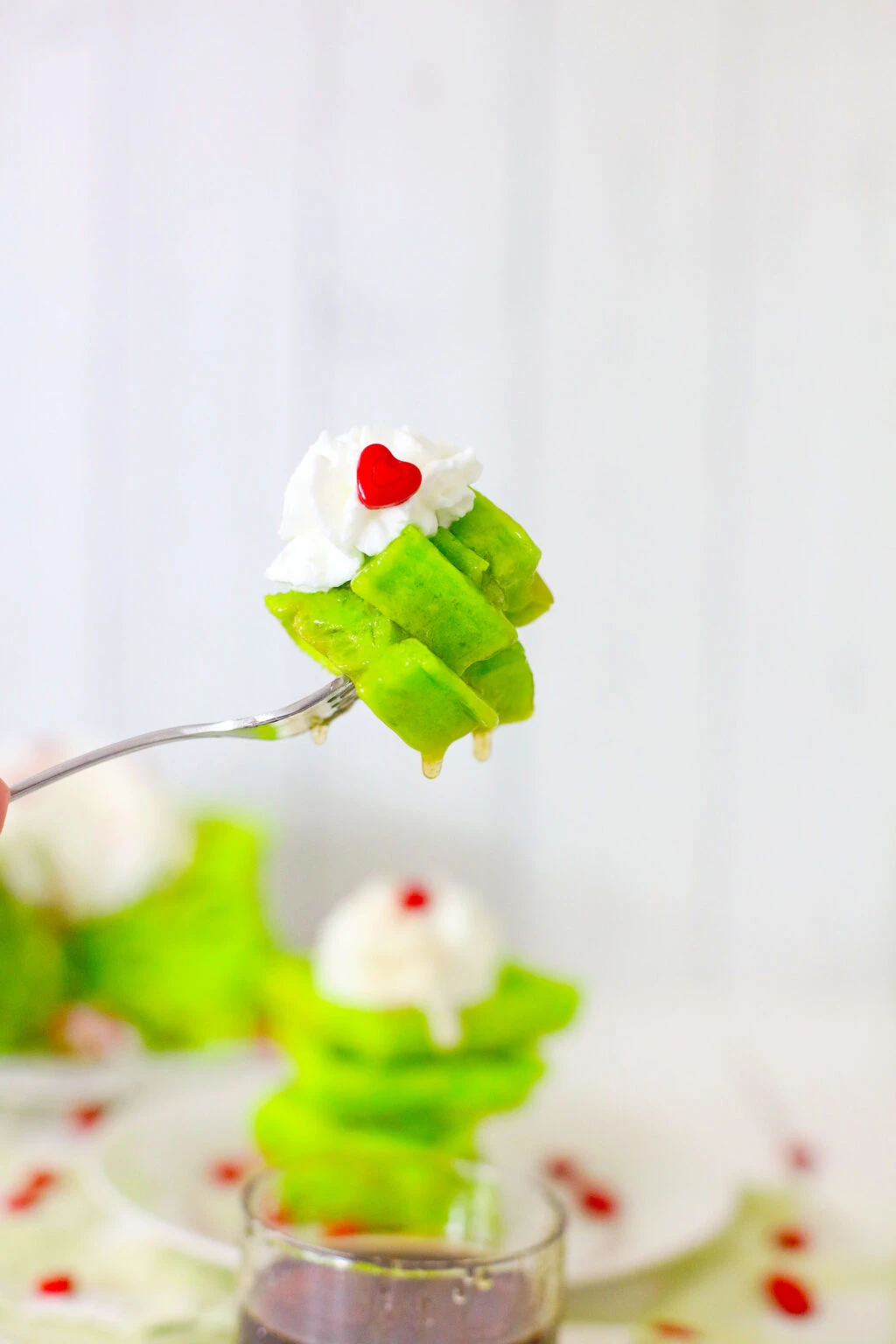 piece of grinch waffle on a fork