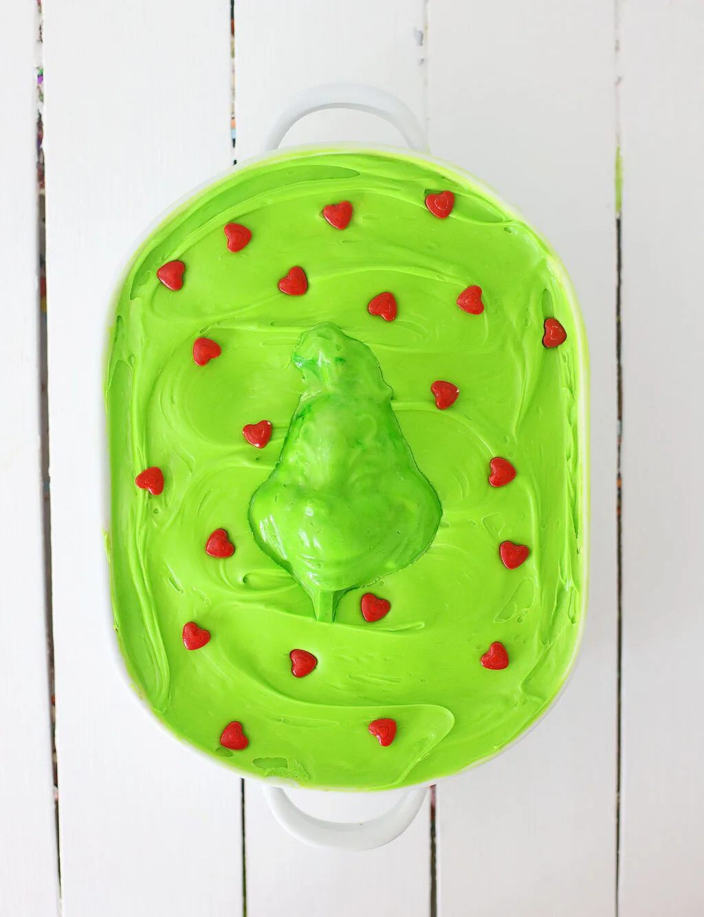 grinch cake in a white pan