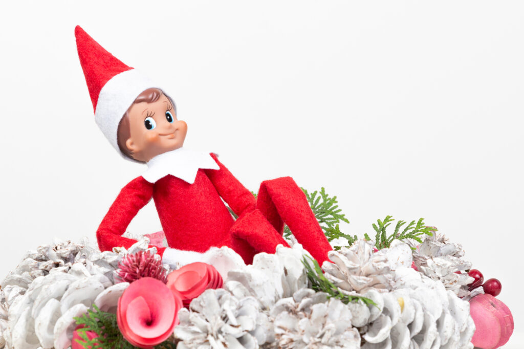 elf on the shelf on a christmas wreath