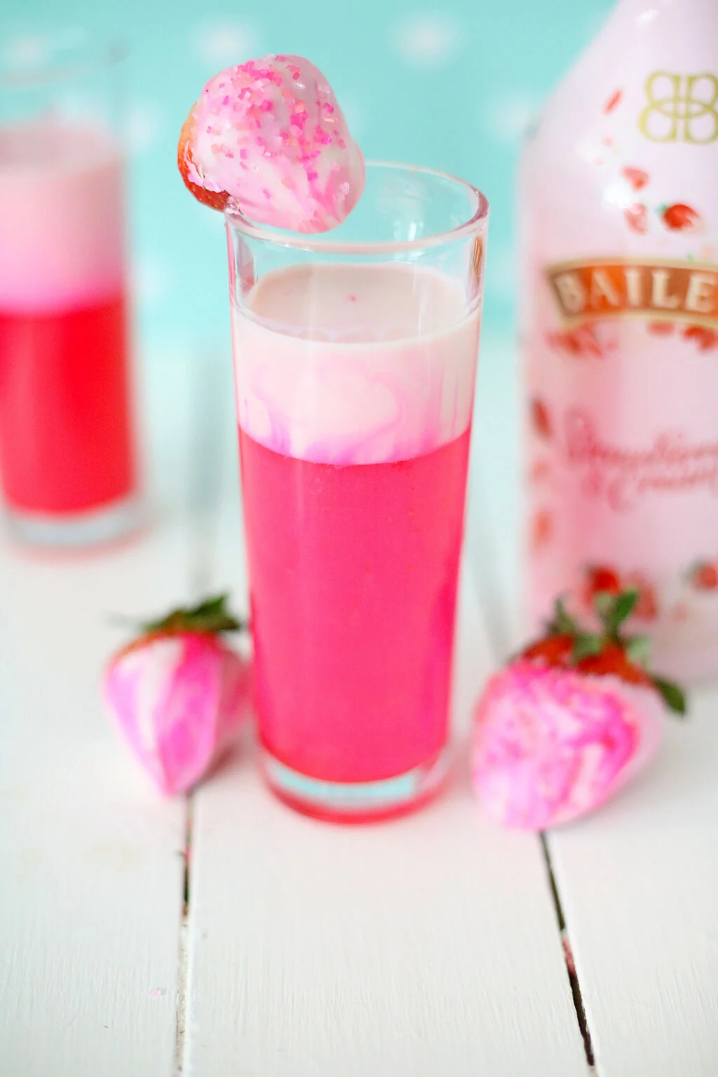 shimmery pink drink in shot glass