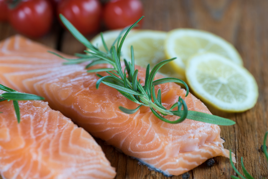raw salmon with fresh lemon and herbs to cook with