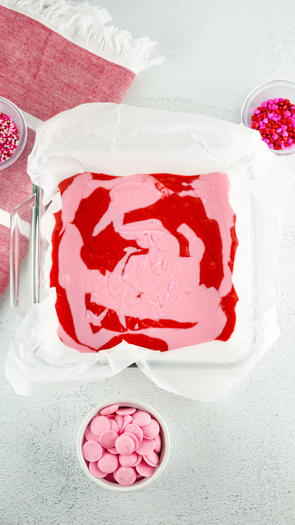 melted pink and red candy melts in a pan to make valentine fudge