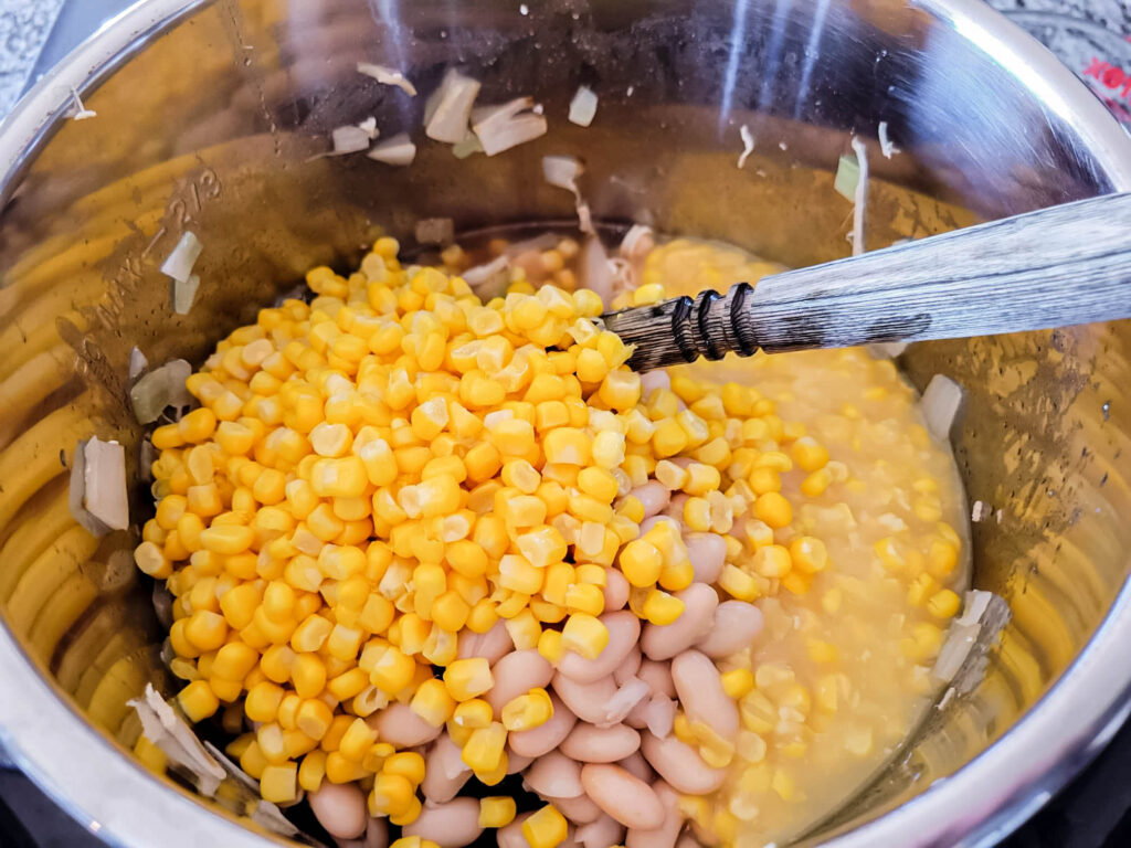 corn and beans added to an Instant Pot