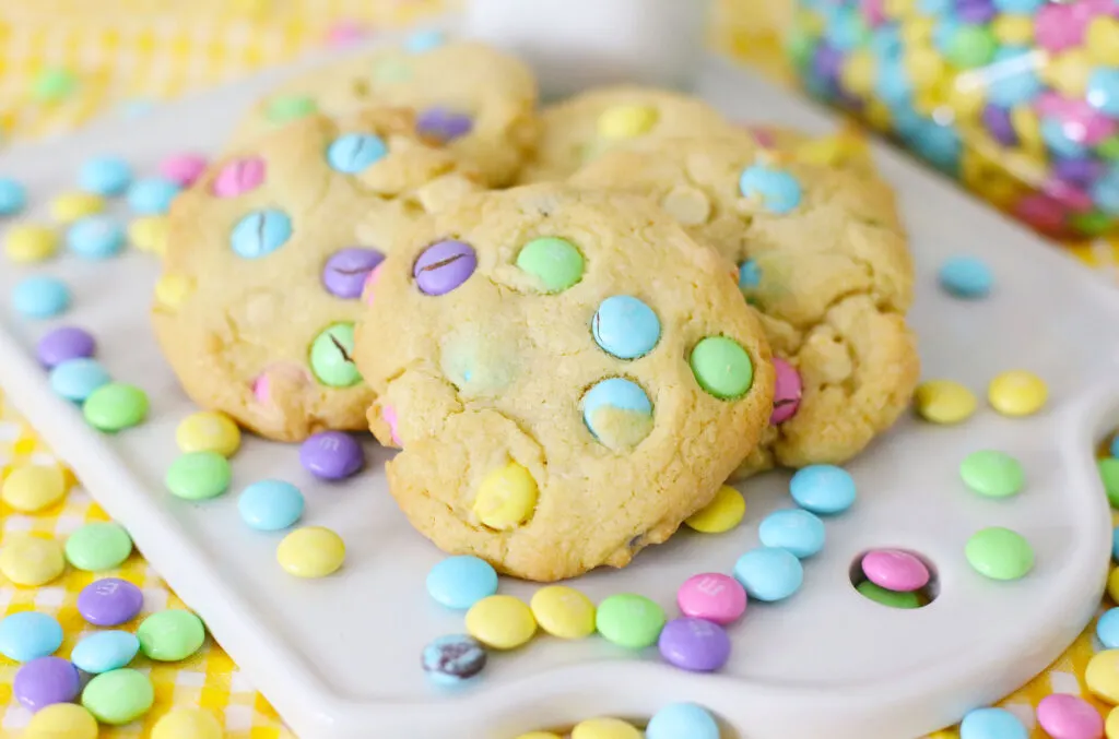 Easter M&M cookies on a white cutting board